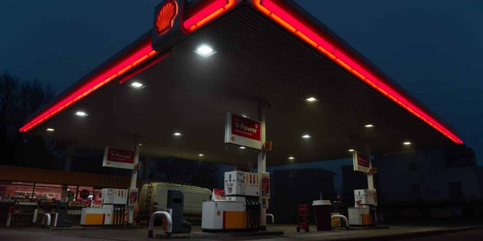 red and white store front during night time